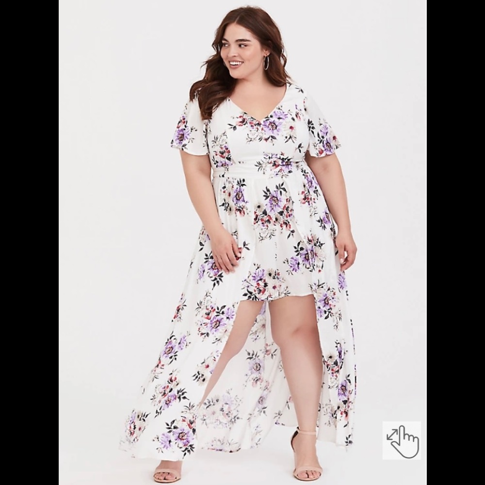 Torrid size 20 ivory walkthrough romper with floral design.